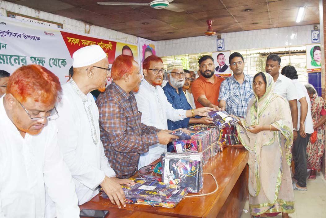 BNP distributes clothes among the helpless in Sherpur during Sharadiya Durga Puja Onnetion